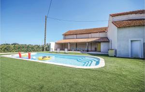 a swimming pool in the yard of a house at Les Tamaris in Le Sambuc