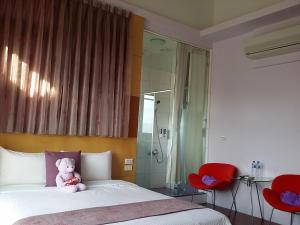 Postel nebo postele na pokoji v ubytování Jing Xiang Hua Nong B&B