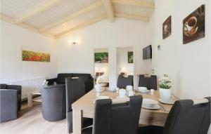 a dining room with a table and chairs at Ferienhausdorf Thale in Thale +28 photos