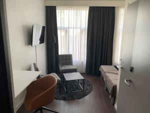 TV a/nebo společenská místnost v ubytování K7 Hotel Oslo