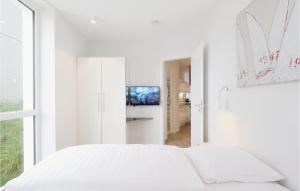 Ein Bett oder Betten in einem Zimmer der Unterkunft Priwallpromenade 23, Whg 1
