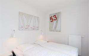 Ein Bett oder Betten in einem Zimmer der Unterkunft Priwallpromenade 23, Whg 1