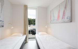 Ein Bett oder Betten in einem Zimmer der Unterkunft Priwallpromenade 23, Whg 1