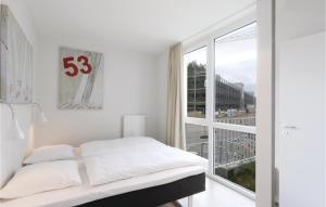 Ein Bett oder Betten in einem Zimmer der Unterkunft Priwallpromenade 23, Whg 1