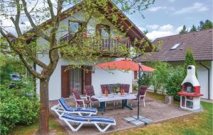 a patio with a table and chairs and a balcony at Ferienhaus 12 In Kirchheim in Kirchheim +31 photos