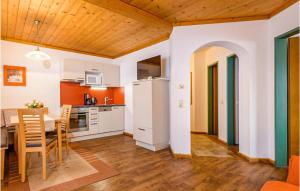 a kitchen and dining room with a table and chairs at Nice Apartment In Flachau With 2 Bedrooms And Wifi in Flachau