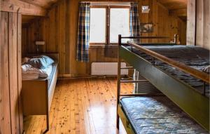 a room with two bunk beds and a window at 6 Bedroom Amazing Home In Hydalsmo in Ofte