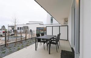 a table and chairs on the balcony of a house at Highend Travemünde - Whg 07 in Travemünde +20 photos