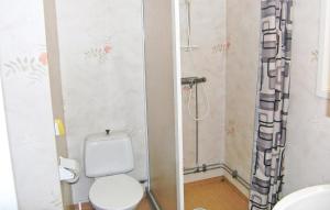 a bathroom with a toilet and a shower at Gormetorp in Barnebo +2 photos