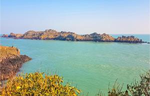 an island in the middle of a body of water at 2 Bedroom Awesome Apartment In Antrain in Antrain +15 photos