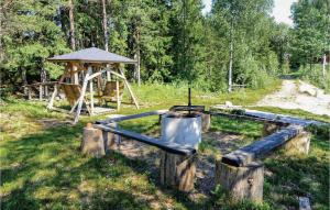a playground with a gazebo in a field at Gorgeous Home In Ambjörnarp With Wifi in Ambjörnarp