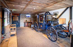 a room with an old car on display in a museum at Nice Apartment In Wagrain With 4 Bedrooms, Wifi And Outdoor Swimming Pool in Wagrain