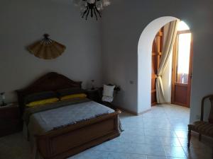 Posteľ alebo postele v izbe v ubytovaní DIMORA LETIZIA -APARTMENT