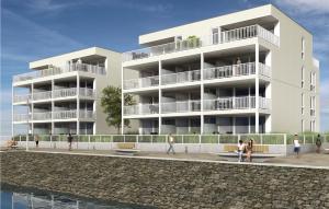 a rendering of a building with people walking in front of it at Priwallpromenade 23, Whg 10 in Travemünde