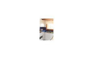 a view of a kitchen from the inside of a room at 1 Bedroom Awesome Home In Lagan in Lagan