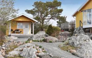 a home with rocks in front of a house at 1 Bedroom Stunning Home In Vrångö in Vrångö