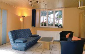 a living room with a couch and a table at Amazing Home In Hachiville With Wifi in Hachiville