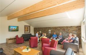 a group of people sitting in a living room at Haus Engel-Emmanuel in Steffeshausen