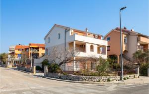 a white house on the side of a street at Nice Apartment In Cres With Wifi in Cres +14 photos