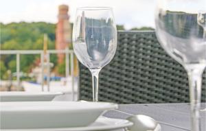 two wine glasses sitting on top of a table at Priwallpromenade 2, Whg 1 in Travemünde