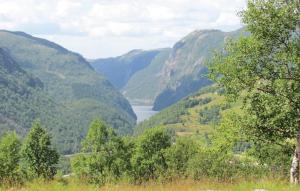 a view of a valley of mountains with a lake at Holiday Home Vikeså Stavtjørn Iii in Hovland