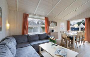 a living room with a couch and a table at Abendrot 2 - Dorf 3 in Priwall