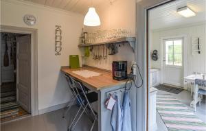 a kitchen with a counter top in a room at Three-Bedroom Holiday Home In Arjang in Smolmark