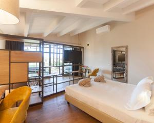 Posteľ alebo postele v izbe v ubytovaní Podere Maremma Spa & Ristorante + 37 fotografií