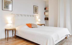 a bedroom with a large white bed with two side tables at Cozy Home In Trie-Château With Wifi in Trie-Château