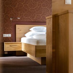 Posteľ alebo postele v izbe v ubytovaní Apartments Tschanun
