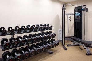 a gym with a rack of dumbbells at Home2 Suites By Hilton Baton Rouge Citiplace in Baton Rouge