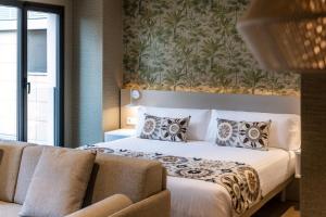 Posteľ alebo postele v izbe v ubytovaní Apartamentos Core Suites Valencia