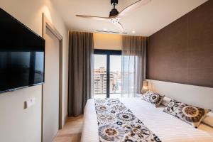 Posteľ alebo postele v izbe v ubytovaní Apartamentos Core Suites Valencia