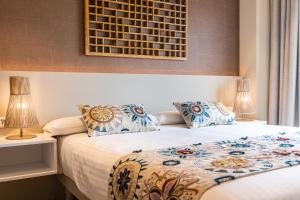 Posteľ alebo postele v izbe v ubytovaní Apartamentos Core Suites Valencia