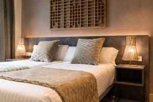 Posteľ alebo postele v izbe v ubytovaní Apartamentos Core Suites Valencia