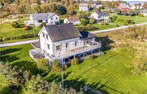 an aerial view of a house on a hill at Awesome Home In Fjrtoft With 5 Bedrooms, Internet And Sauna in Fjørtoft