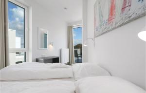 Ein Bett oder Betten in einem Zimmer der Unterkunft Priwallpromenade 2, Whg 11