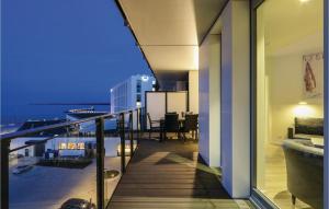 a balcony of a building with a view of the ocean at Highend Travemünde - Whg 407 in Travemünde +26 photos