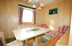 a small dining room with a table and chairs at 5 Bedroom Stunning Home In Schnberg Lachtal in Lachtal