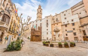 a city street with a clock tower in the distance w obiekcie Amazing Home In Bocairent w mieście Bocairent