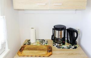a coffee maker on a counter in a kitchen at Awesome Home In Insel Poel in Insel Poel