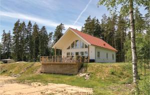 a small house on top of a hill at 4 Bedroom Awesome Home In Skillingaryd in Skillingaryd