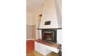 a living room with a fireplace in the corner at Holiday Home Björkvägen Höör in Höör +12 photos