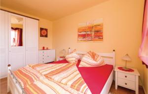 a bedroom with a large bed with at Awesome Home In Winten With Ethernet Internet in Winten