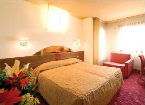 Łóżko lub łóżka w pokoju w obiekcie Hotel Ristorante La Casona