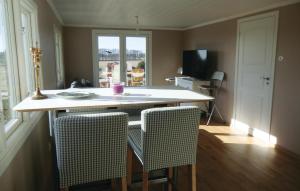 a kitchen with a table and chairs and a window at Gorgeous Home In Löttorp With Wifi in Löttorp