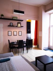 a living room with a table and a dining room at Better Than Home Apartment Budapest in Budapest
