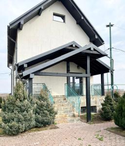 a building with stairs and a stair case at Waincris spa in Stolniceni-Prăjescu