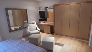 a bedroom with a bed and a mirror and a desk at Hotel Palau dels Osset in Forcall