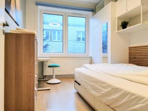 Postel nebo postele na pokoji v ubytování Scandian Apartments - City Hub Tallinn